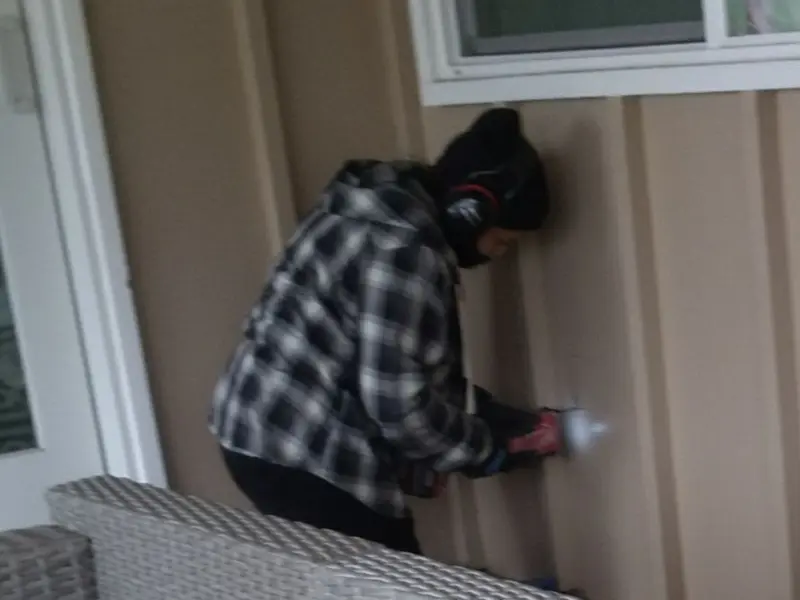 Professional electrician installing an exterior outlet in North Branch